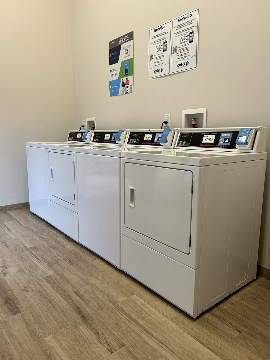 A row of washing machines in a laundromat.