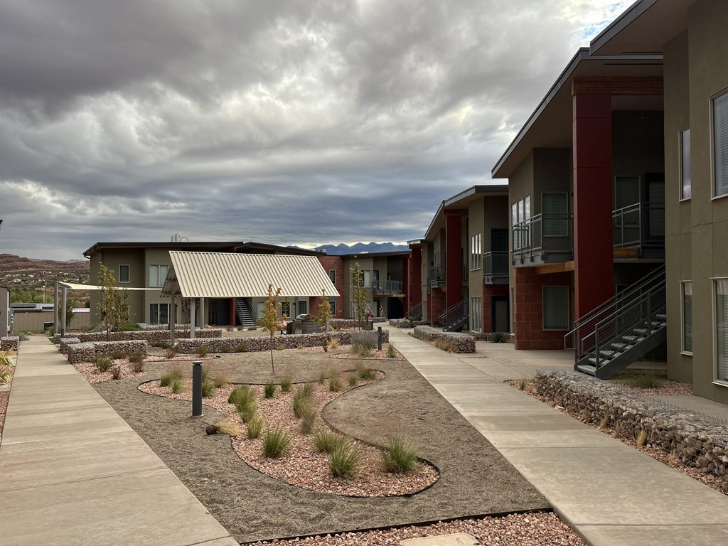 Buildings with sidewalks and landscaping.