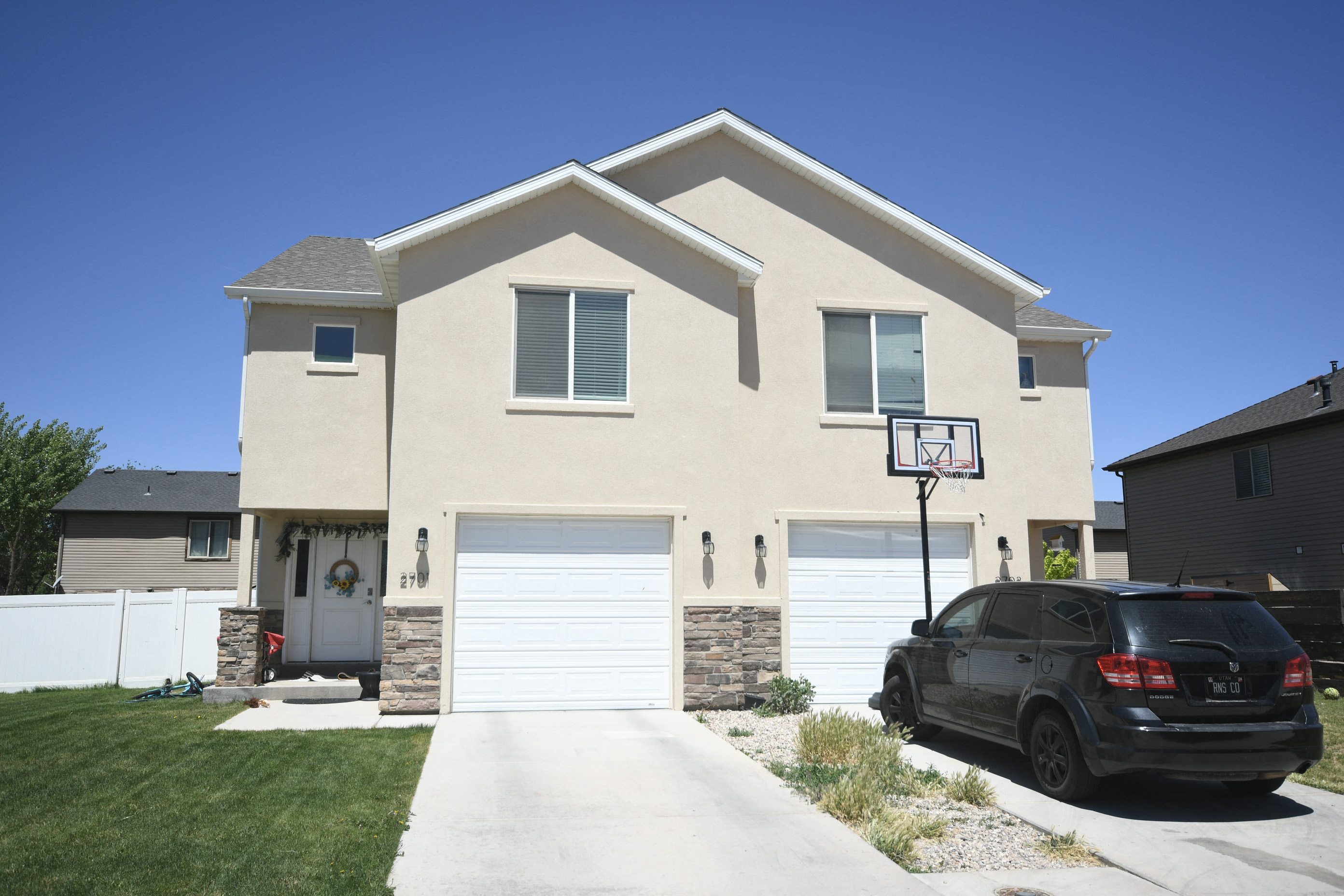 a house with a car parked in front of it