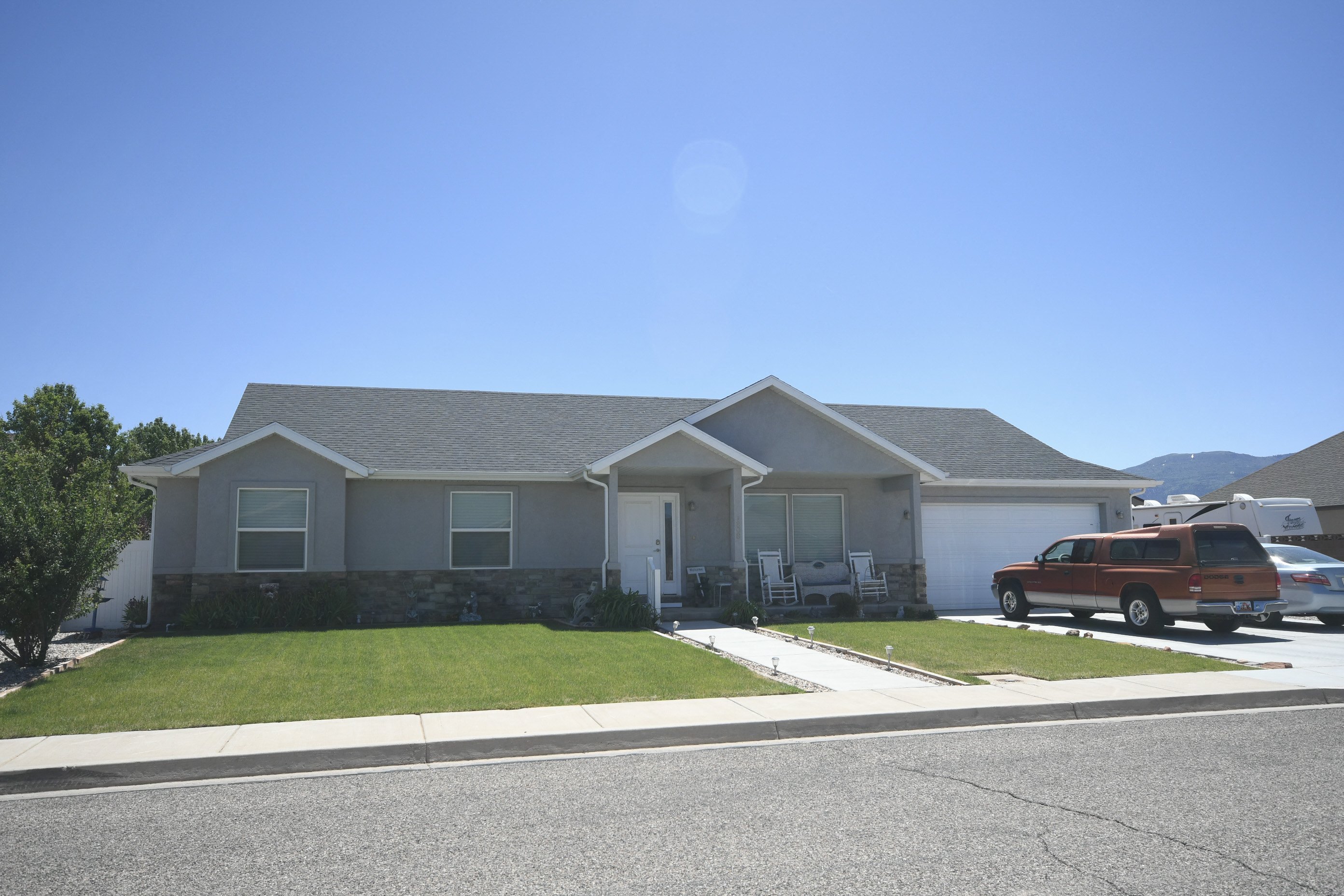 a house with a truck parked in front of it