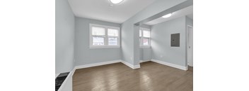A room with a window and a door.