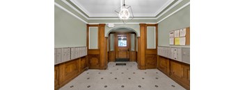 A room with wooden doors and a tiled floor.