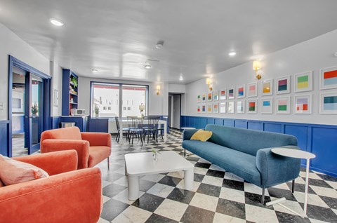 A living room with a black and white checkered floor.