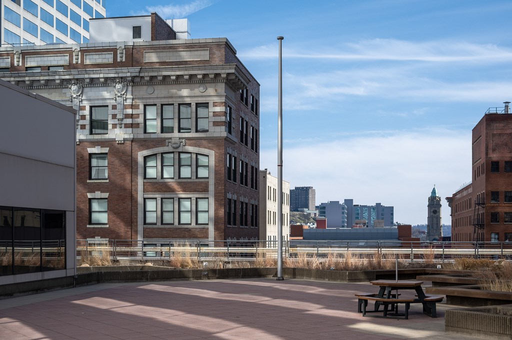 A large building with a clock tower in the background.