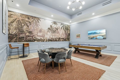 A room with a pool table and a jungle mural on the wall. A room with a pool table and a jungle mural on the wall. at LiveWell Apartments, Pennsylvania, 15222