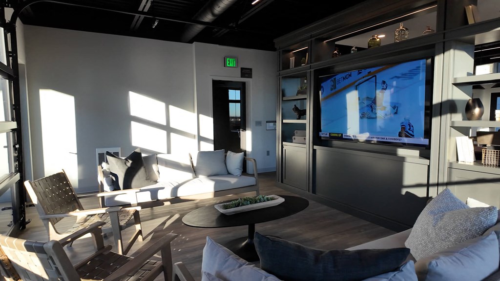 Community Lounge with a flat screen TV and comfortable seating.