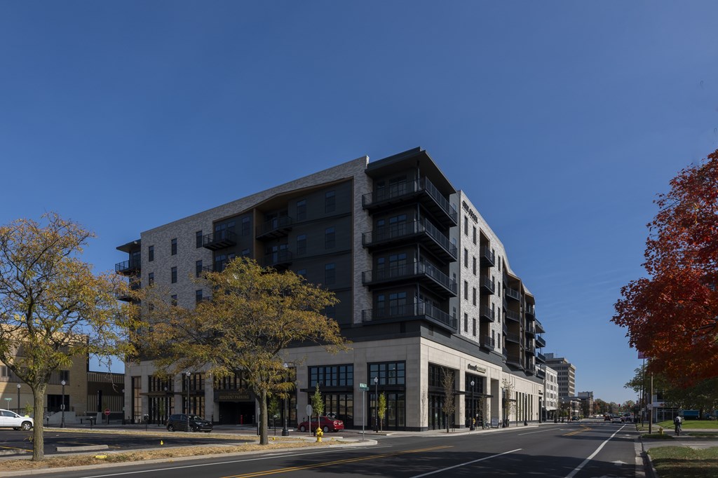 A modern multi-story building with a black and white exterior. at The Pearl, Fort Wayne, IN