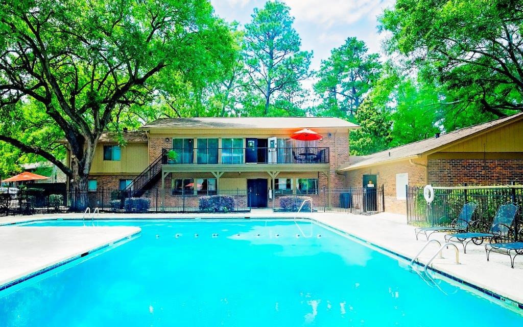 a swimming pool in front of a house