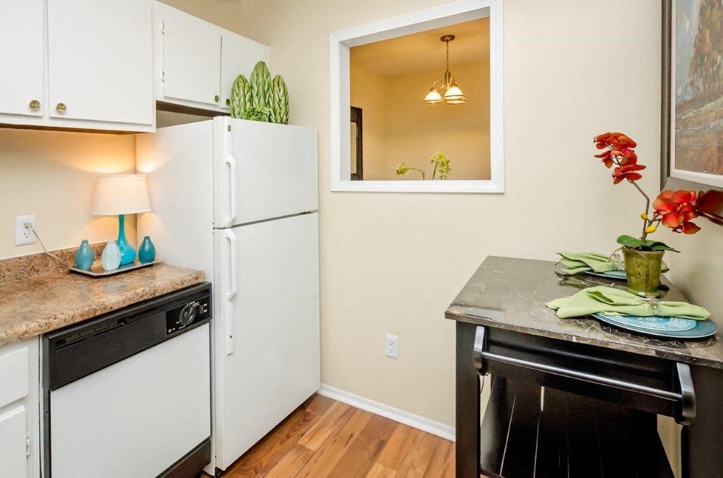 a kitchen with a refrigerator and a counter top