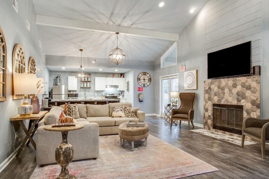 a living room with a couch and a fireplace