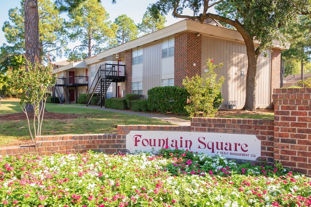 a building with a fountain square sign in front of it