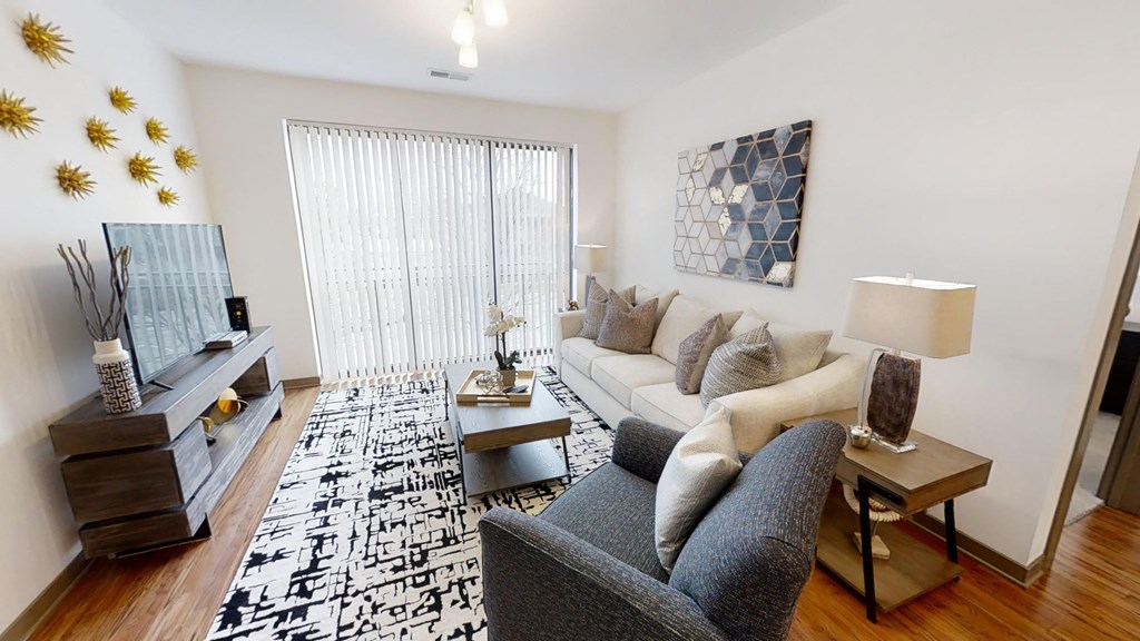 a living room with a couch and a tv