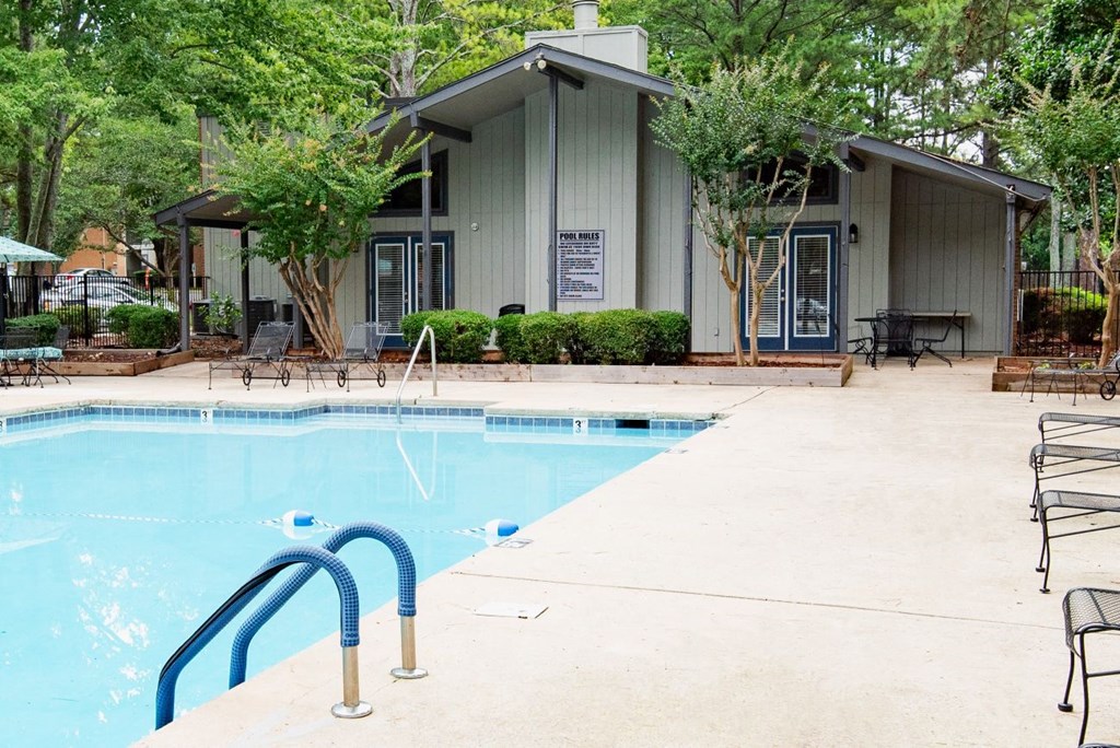 a swimming pool with a building in the background