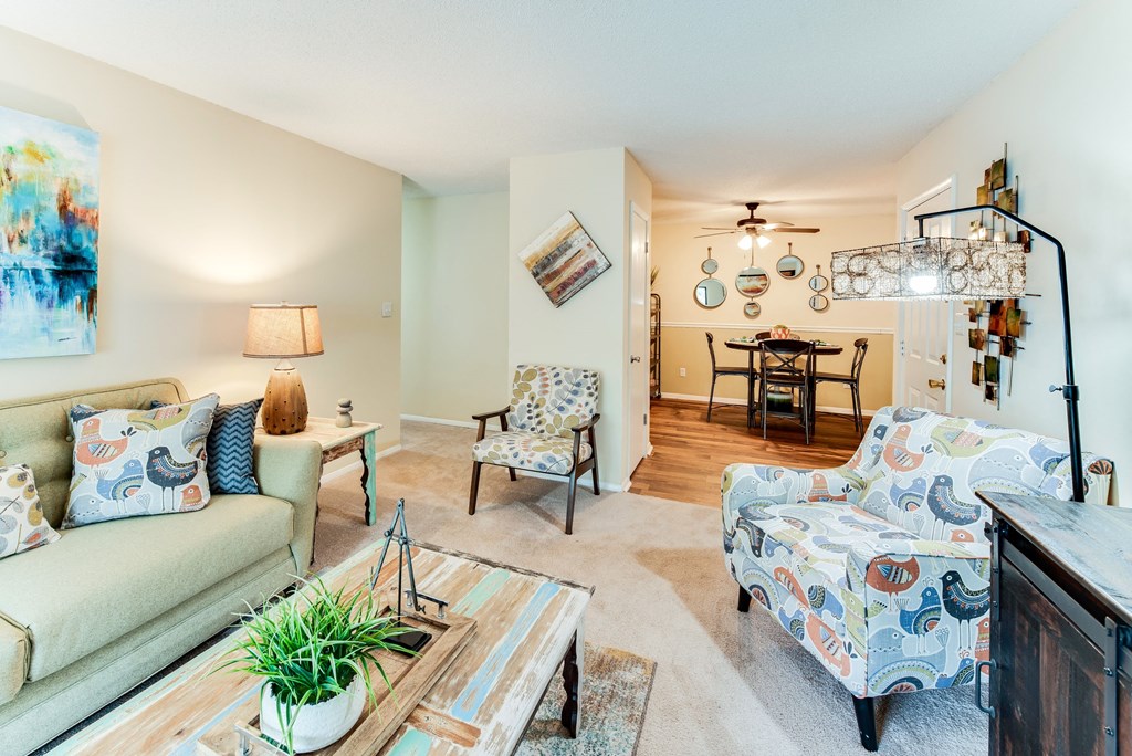 the living room is open to the dining room and kitchen