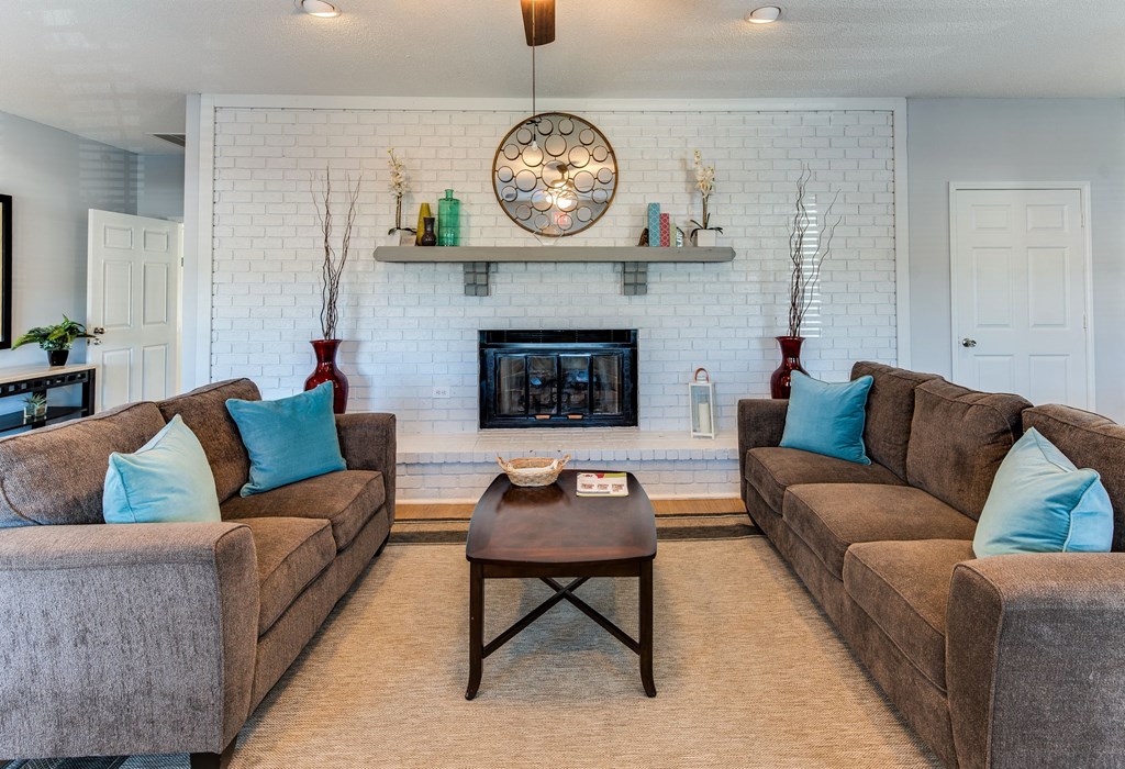 a living room with couches and a coffee table