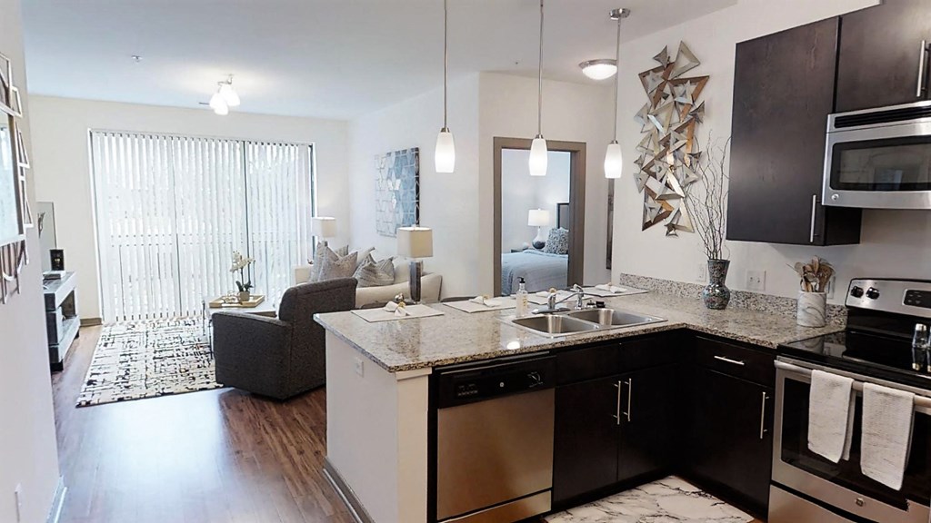 a kitchen and living room in an apartment