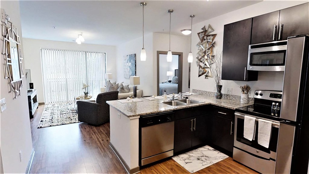 a kitchen and living room in an apartment