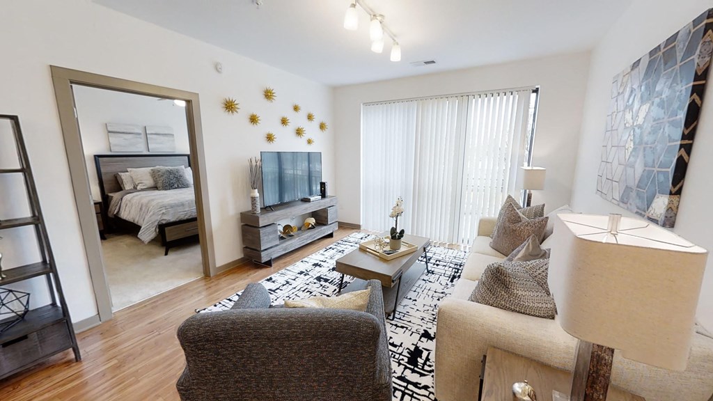 a living room with a mirror and a couch