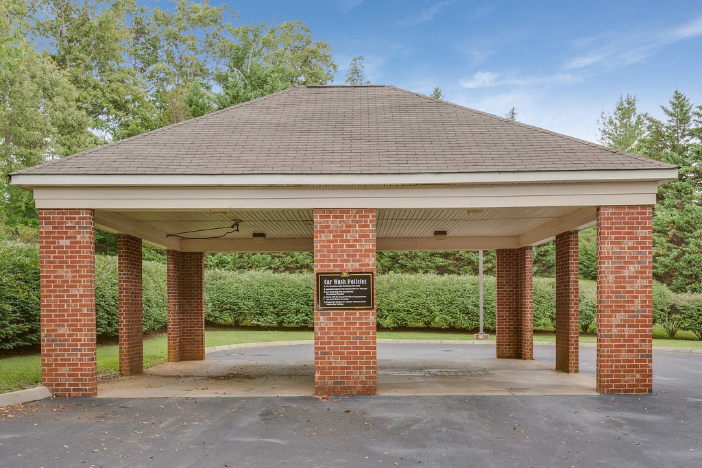 a covered park pavilion with a sign on it