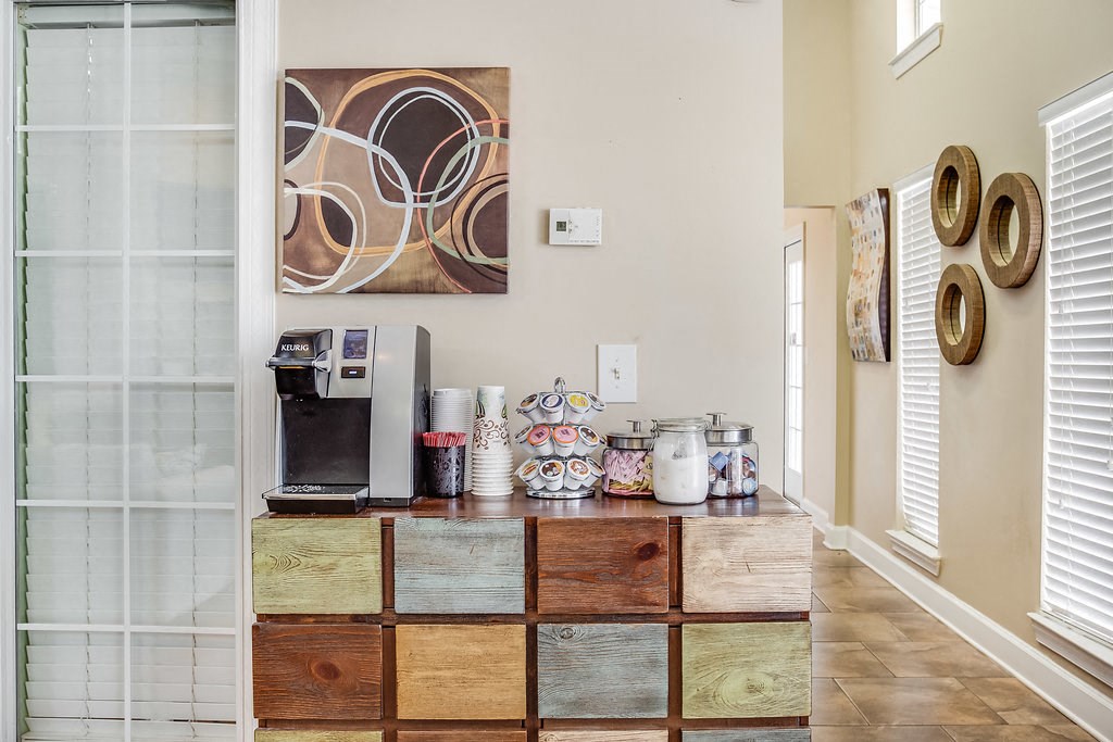 a kitchen with a counter and a coffee machine on top of it