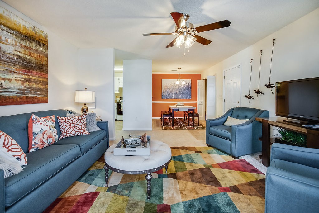 a living room with couches and a tv