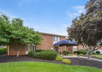 Clubhouse at Falcon Creek Apartment homes Spacious, landscaped outdoor terrace with lush seating, grills and a fire pit - Photo Gallery 2