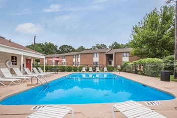 Clubhouse at Falcon Creek Apartment homes Spacious, landscaped outdoor terrace with lush seating, grills and a fire pit - Photo Gallery 3