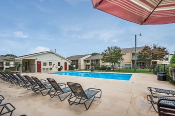 Clubhouse at Falcon Creek Apartment homes Spacious, landscaped outdoor terrace with lush seating, grills and a fire pit - Photo Gallery 4