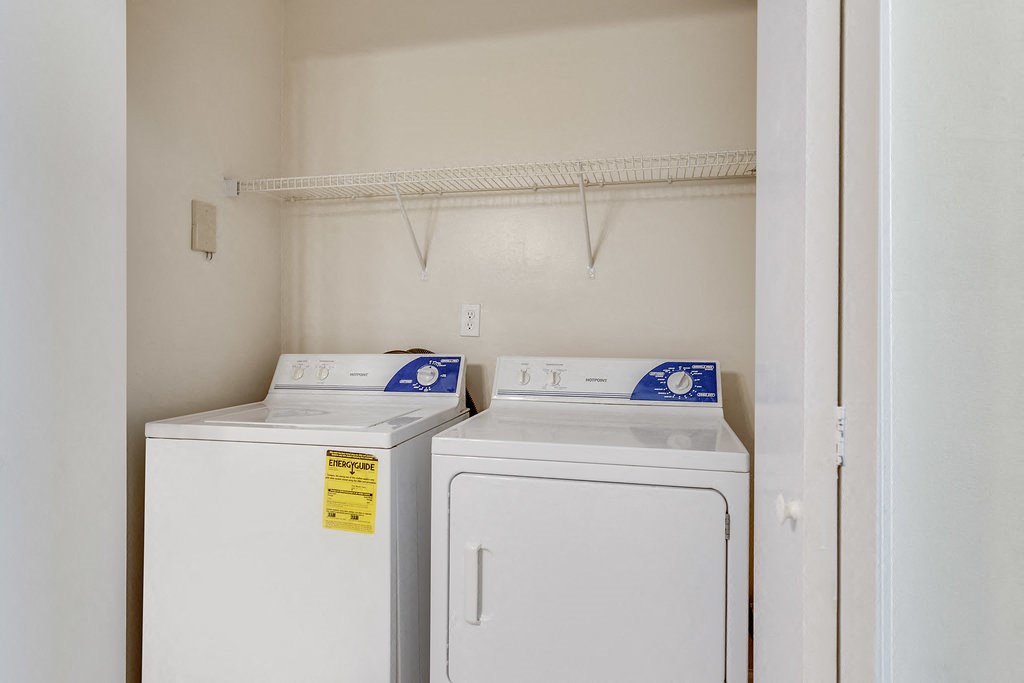 a laundry room with two washes and a dryer in it