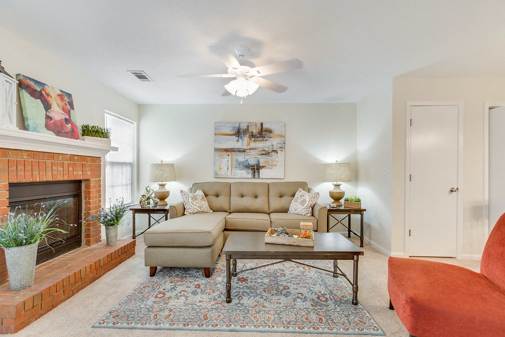 a living room with a couch and a fireplace