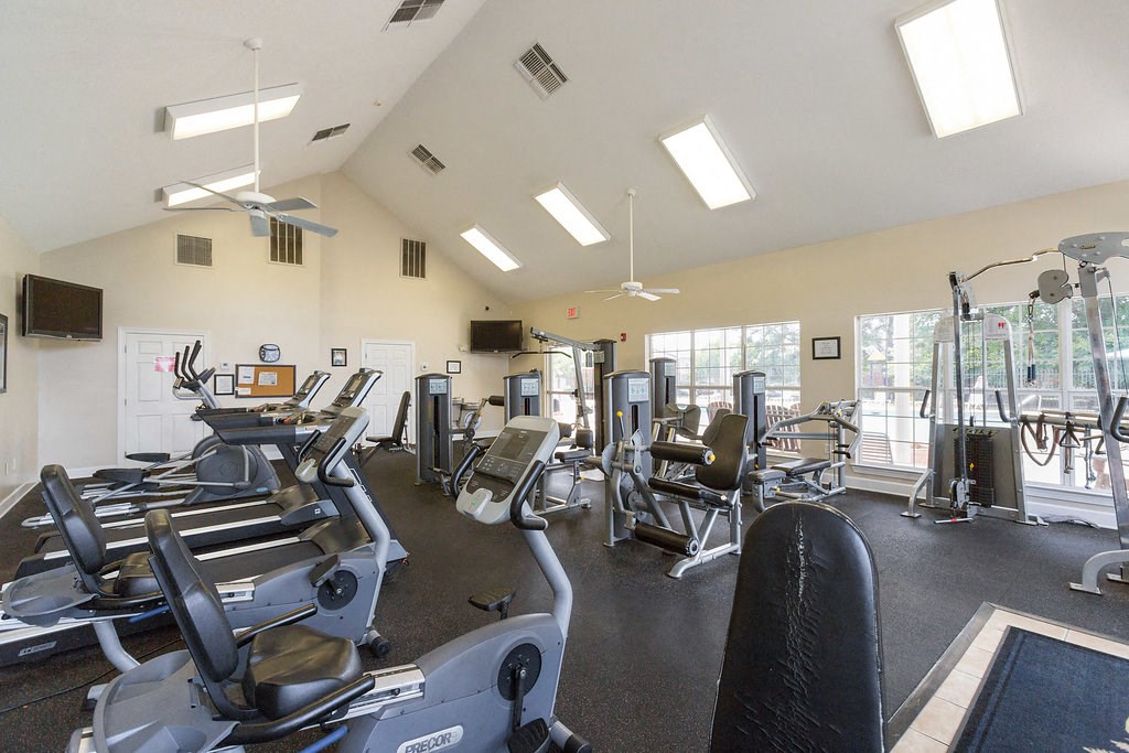 a gym with cardio machines and other exercise equipment