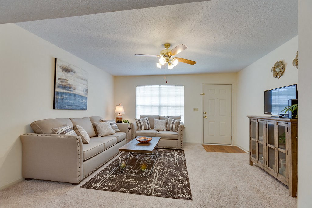 a living room with couches and a coffee table