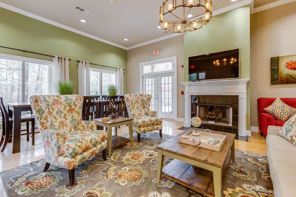 a living room with furniture and a fireplace