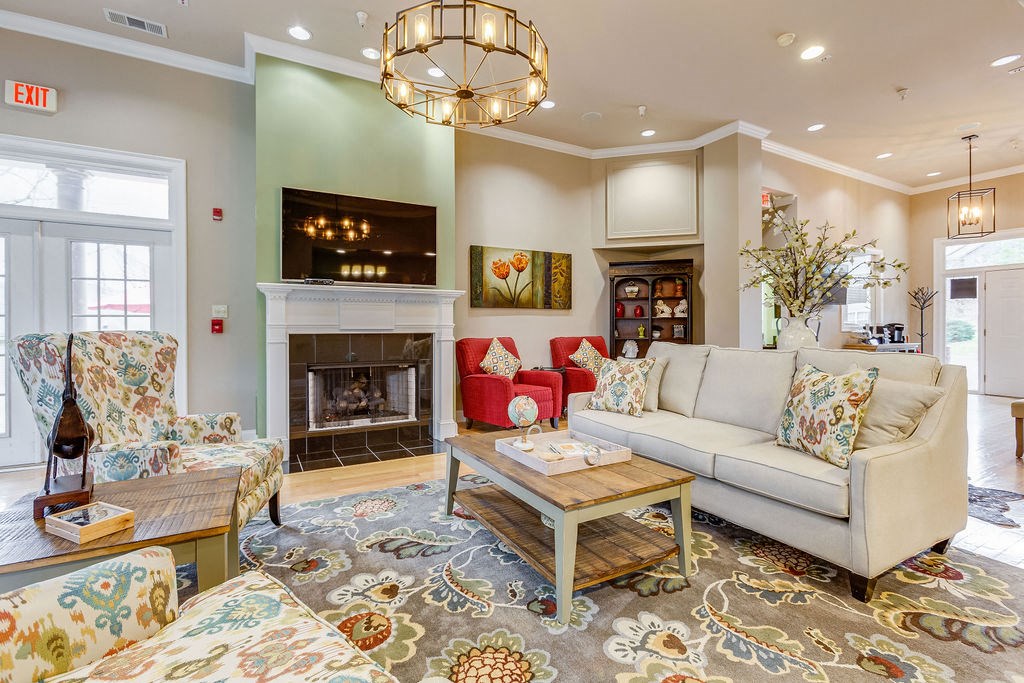 a living room with a couch and a fireplace