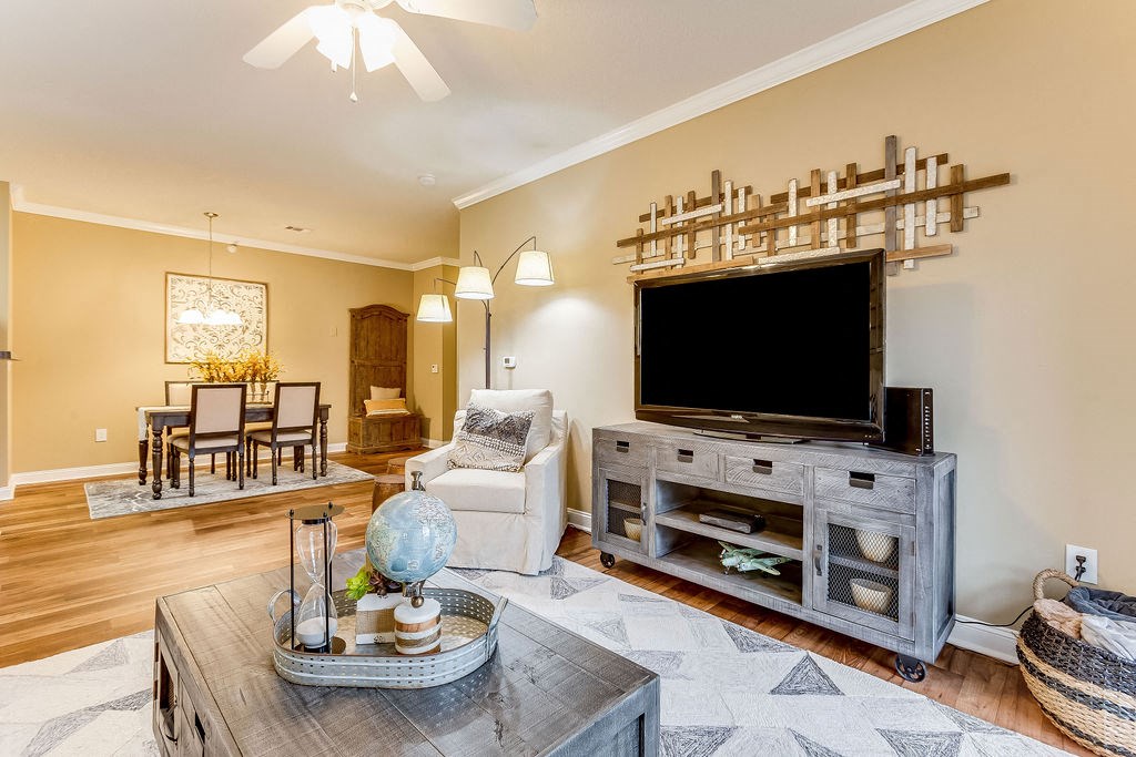 a living room with a tv and a table