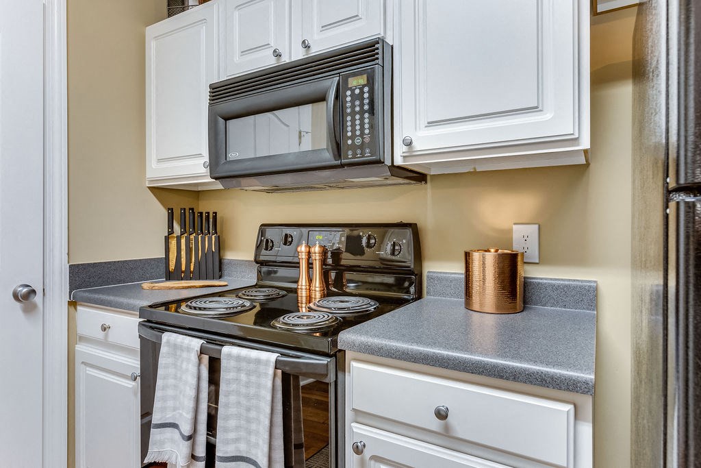 a kitchen with a stove and a microwave