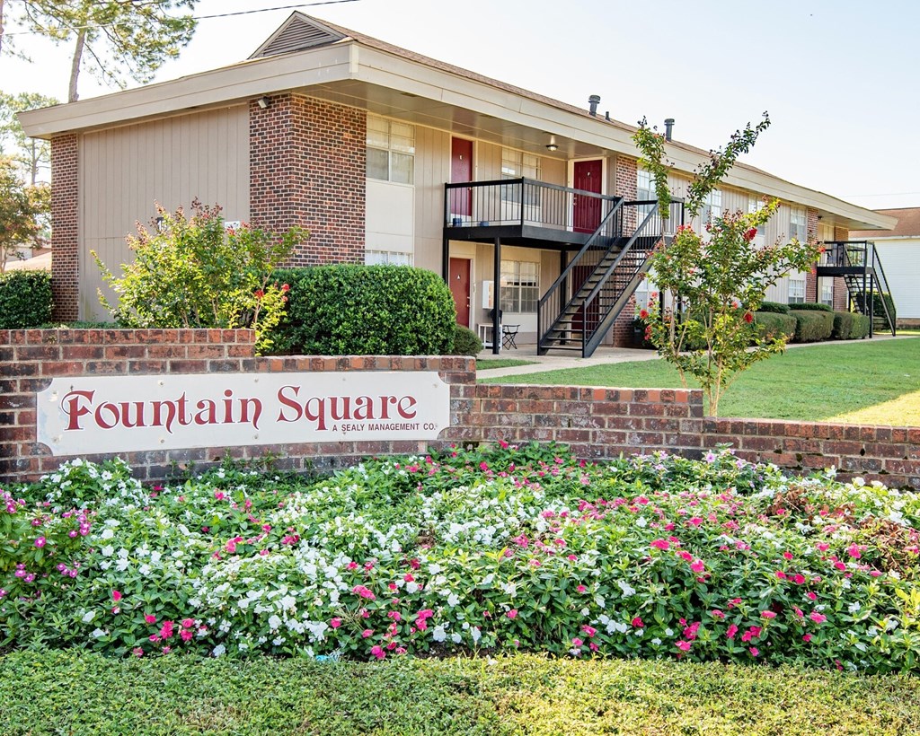 a building with a fountain square sign in front of it