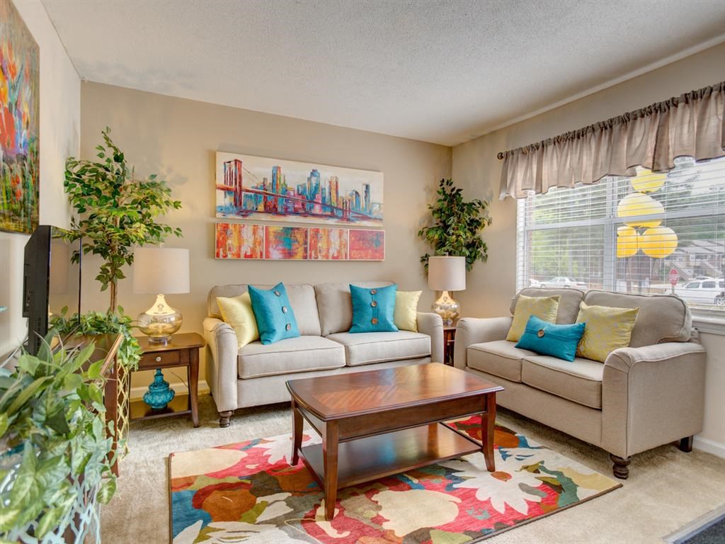 a living room with a couch and a table