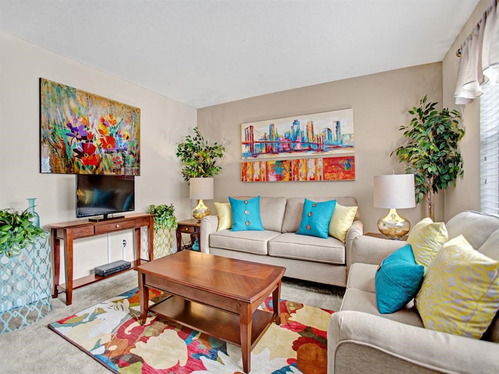 a living room with couches and a table