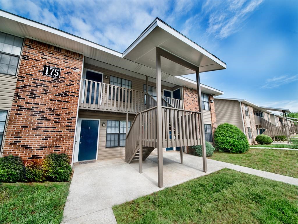a building with a porch and a staircase