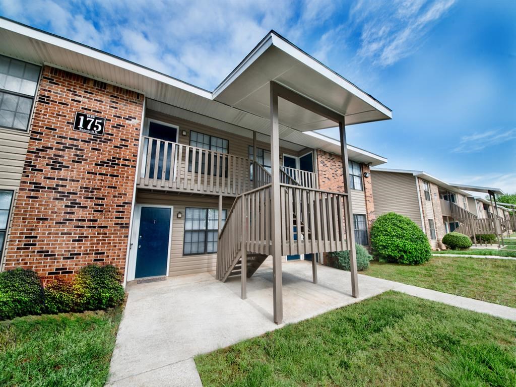 a building with a porch and a staircase