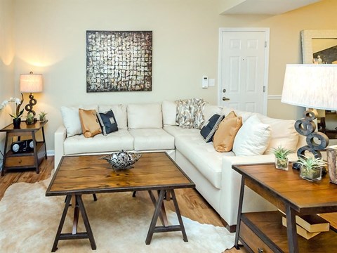 a living room with a couch and a table