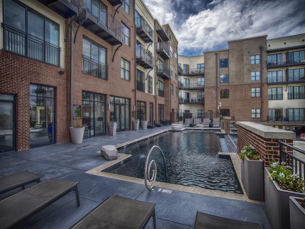 a swimming pool in the middle of an apartment building