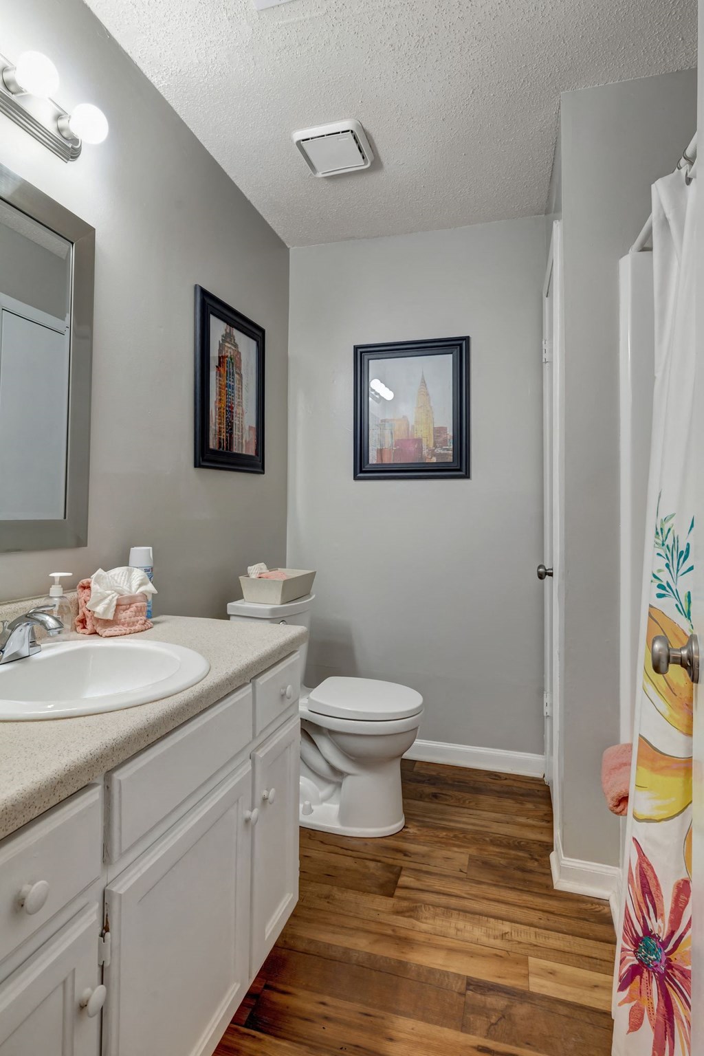 a bathroom with a toilet and a sink and a mirror