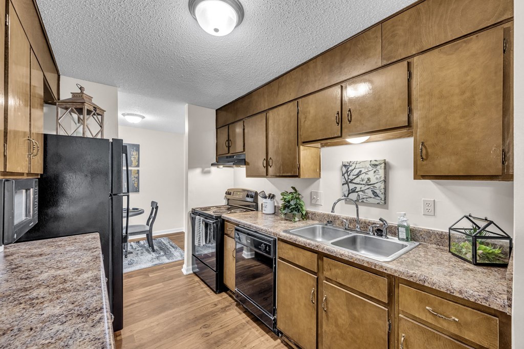 a kitchen with a sink and a refrigerator