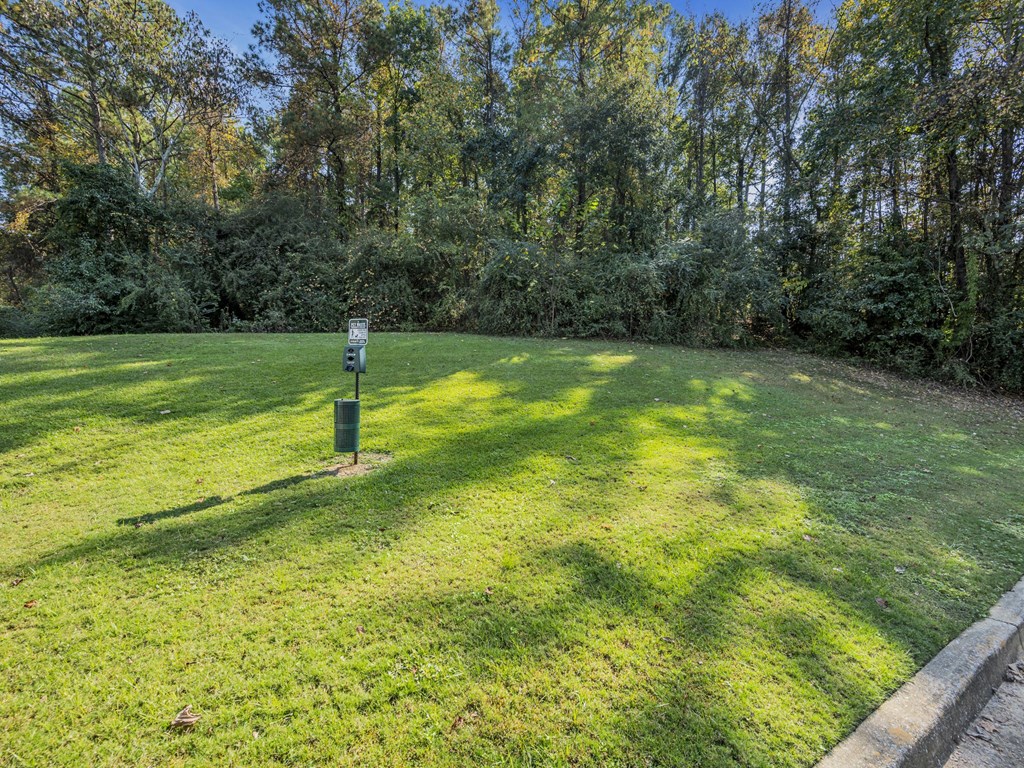 a lawn with a sign in the middle of it