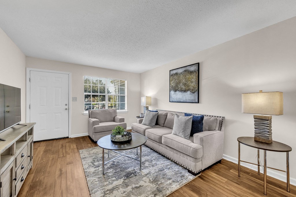 a living room with a couch and a table