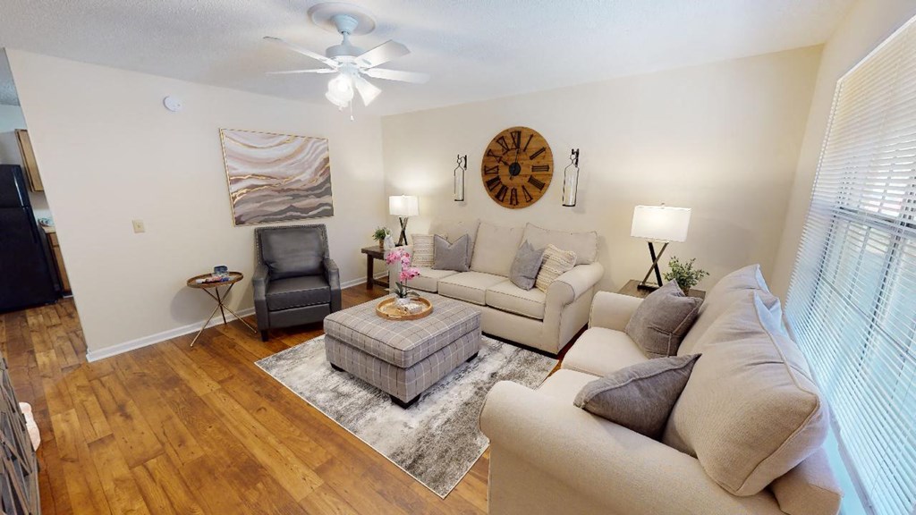 a living room with couches and a coffee table