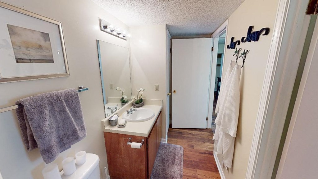 an empty bathroom with a sink and a mirror