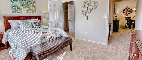 a bedroom with a bed and a closet